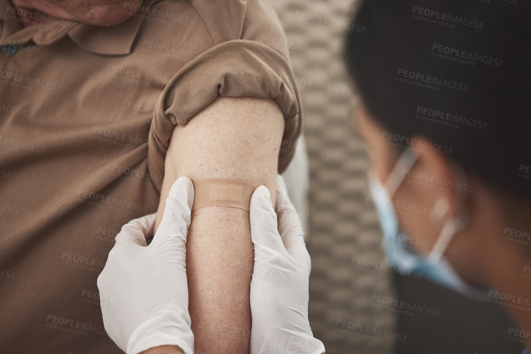 Buy stock photo Hands, arm and plaster with gloves for vaccine, care or flu medicine in retirement home living room. Closeup, doctor and bandage for health, wellness or virus with healthcare pharmaceutical drugs