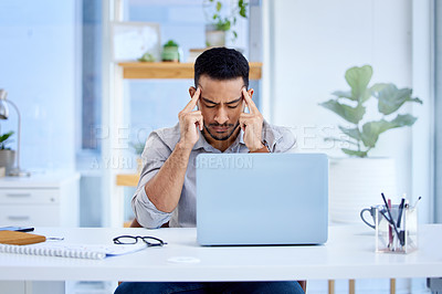Buy stock photo Mental health, businessman with a headache and laptop on his desk in office at workplace. Anxiety or depression, mistake or problem and male person frustrated or stress sitting at his workstation 