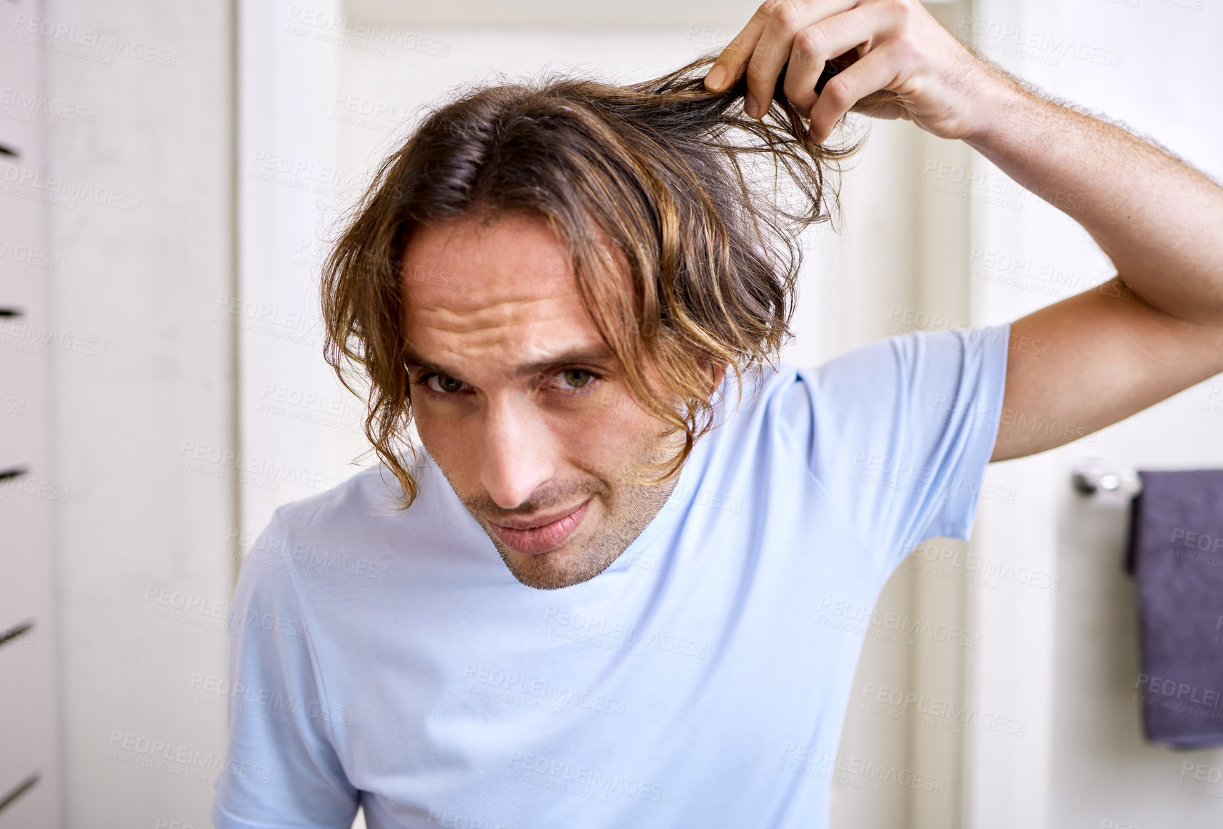 Buy stock photo Healthcare, man checking his hair and grooming in bathroom of his home. Mental health or stress, body care or health wellness treatment and male person checking head for haircare at his house