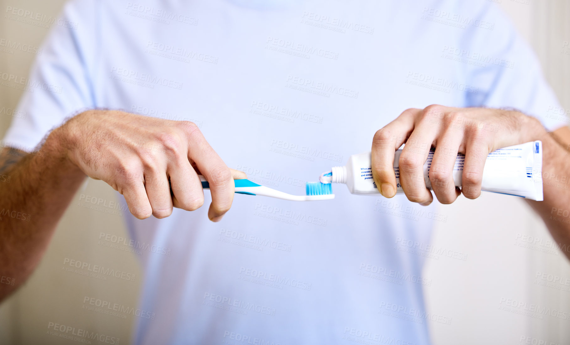 Buy stock photo Shot of a man applying toothpaste to his toothbrush