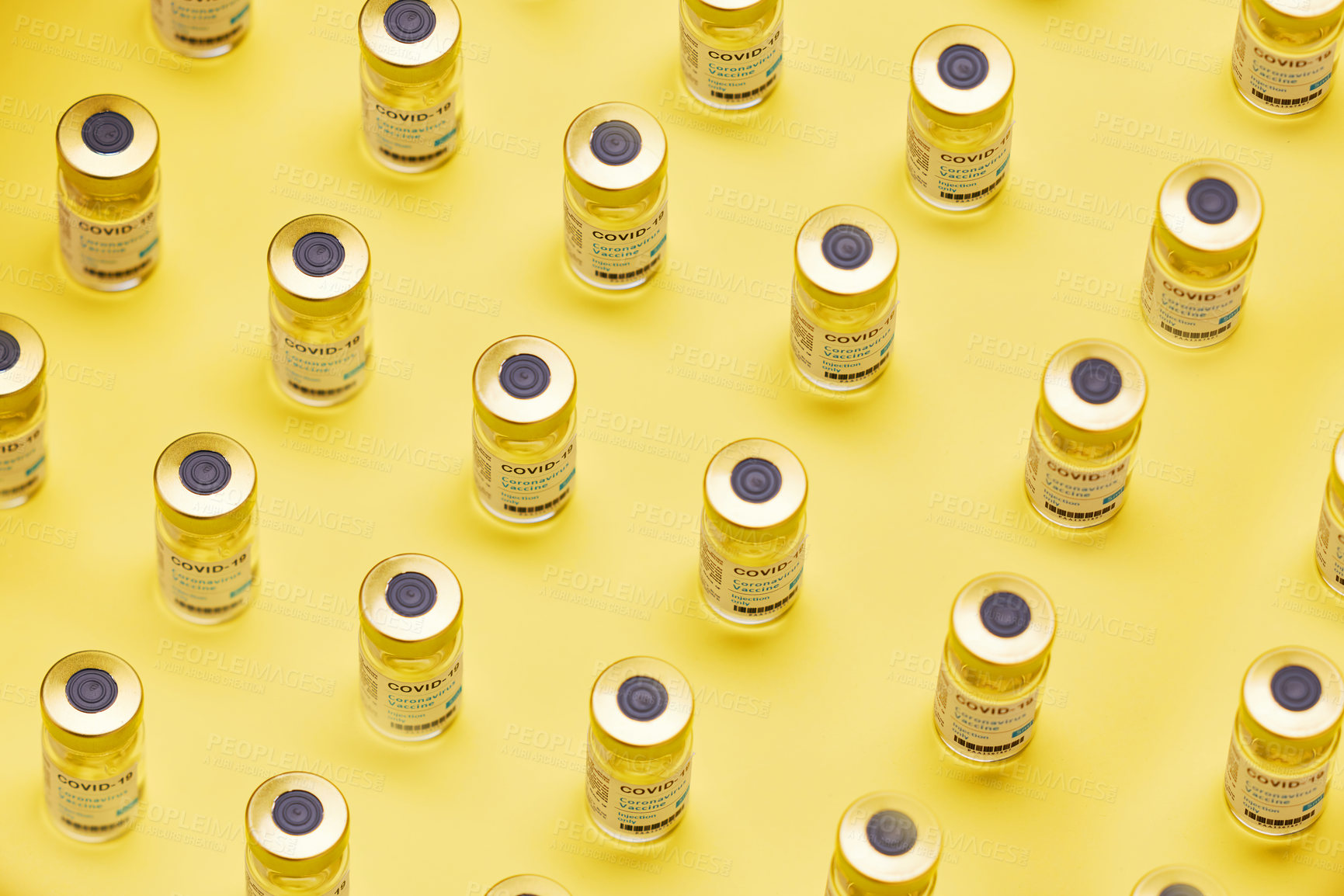 Buy stock photo Studio shot of vaccine tubes against a yellow background