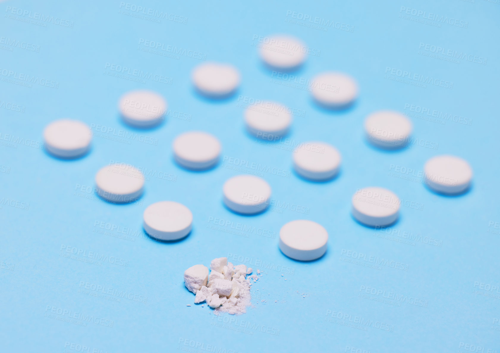 Buy stock photo Studio shot of pills against a blue background