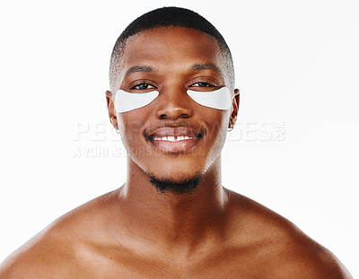 Buy stock photo Grooming, black man and portrait with cosmetic patches for hydration in dermatology, hygiene on white background. Male person, hydrogel and skincare for fresh, morning routine and product for glow