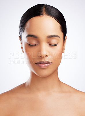 Buy stock photo Studio shot of a beautiful young woman posing against a white background