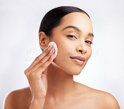 Buy stock photo Studio, portrait and woman with cotton for skincare, makeup removal and cleansing for wellness. Female model, cosmetics and products for cleaning, facial treatment and swab pad by white background