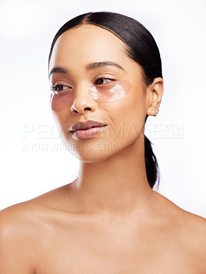 Buy stock photo Skincare, eye patches and cosmetics for woman, studio and  treatment for beauty, vitamin c and hydration. White background, person and girl with healthy skin, routine and grooming with dermatology