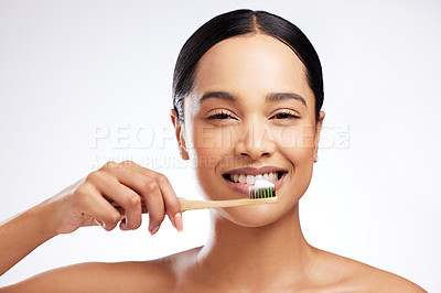 Buy stock photo Tooth brush, portrait and woman in studio for oral health, wellness and cleaning in morning. Dental, teeth and happiness with model girl, smile and hygiene for cavities and decay by white background