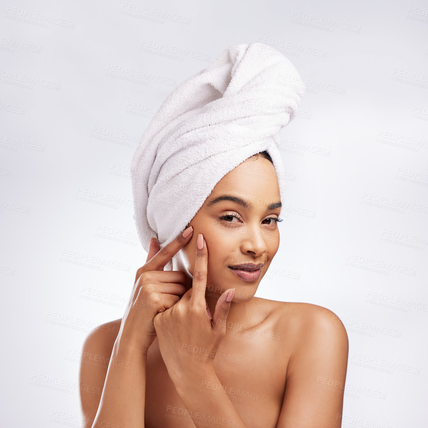 Buy stock photo Skincare, pimple and portrait of woman in studio for cosmetics, blemish or treatment on white background. Spa, body and hand of model with towel for popping zit, acne breakout or wellness routine