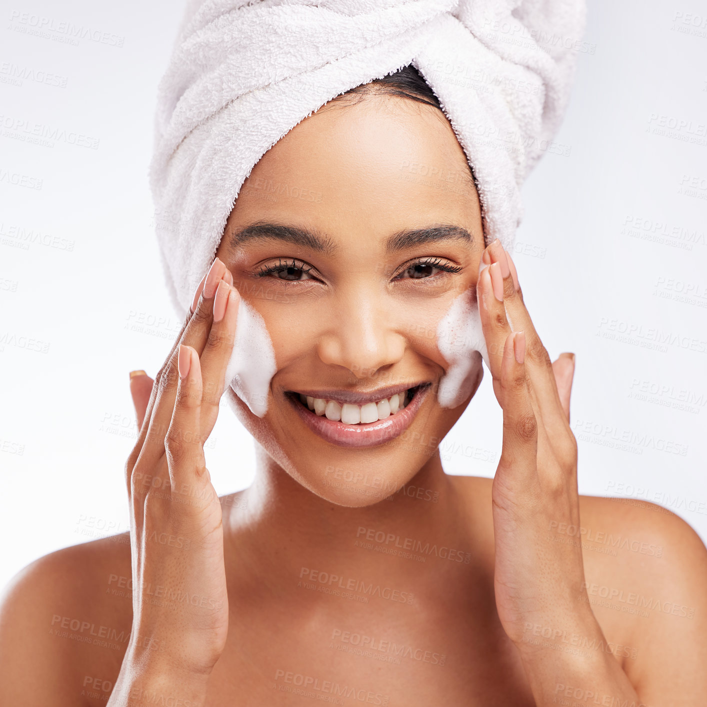 Buy stock photo Foam, hands and portrait of woman in studio with skincare for cosmetic, natural glow or treatment on white background. Towel, body and model cleaning face for wellness, dermatology or morning routine
