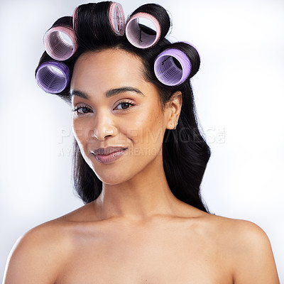 Buy stock photo Beauty portrait, woman and rollers in hair for curly style with salon aesthetic and texture maintenance in studio. Model smile, female person and curlers for hairstyle results by white background