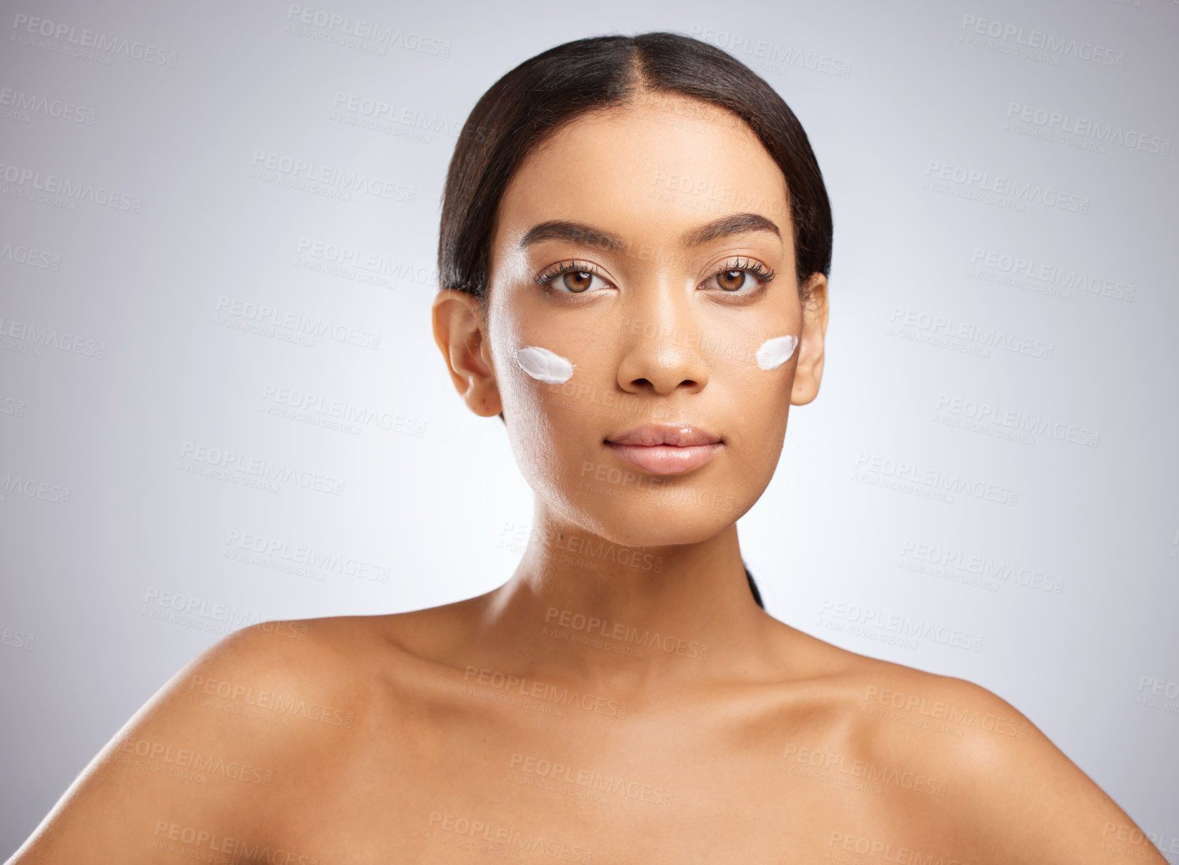 Buy stock photo Portrait, cream and woman with sunscreen for skincare and dermatology in studio background. Calm, girl and model relax with lotion moisturizer on face for healthy glow or natural beauty and cosmetics