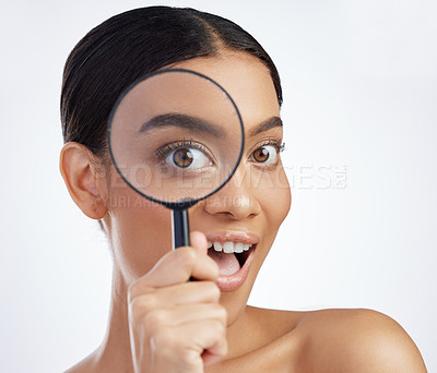 Buy stock photo Skincare, portrait and woman with magnifying glass in studio for skin, inspection and cosmetics on white background. Face, beauty and girl model with search lens for fine lines, acne or dermatology