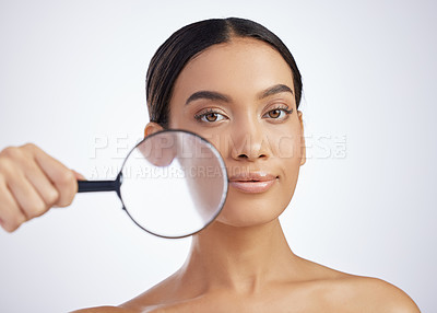 Buy stock photo Skincare, portrait or girl with magnifying glass in studio for skin, inspection or cosmetics on white background. Face, beauty or girl model with search lens for fine lines, inspection or dermatology