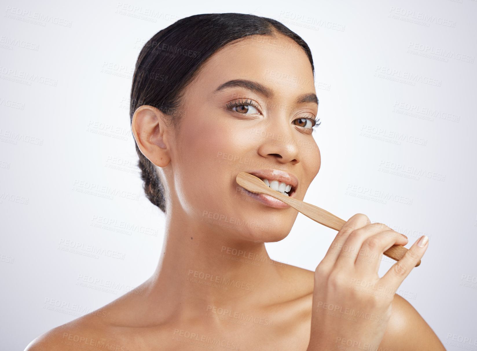 Buy stock photo Portrait, dental or girl brushing teeth in studio for wellness, fresh breath or oral care on white background. Face, toothpaste or model with eco friendly bamboo toothbrush for mouth, gum or cleaning