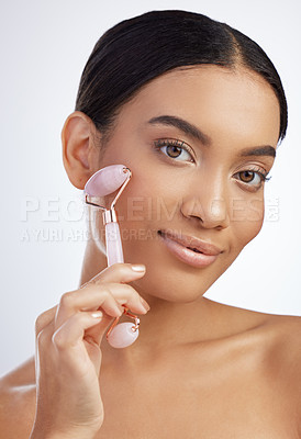 Buy stock photo Skincare, portrait or derma roller by woman in studio for facelift, cosmetics and beauty collagen on white background. Rose quartz, crystal or model with stone facial, lymphatic drainage or massage