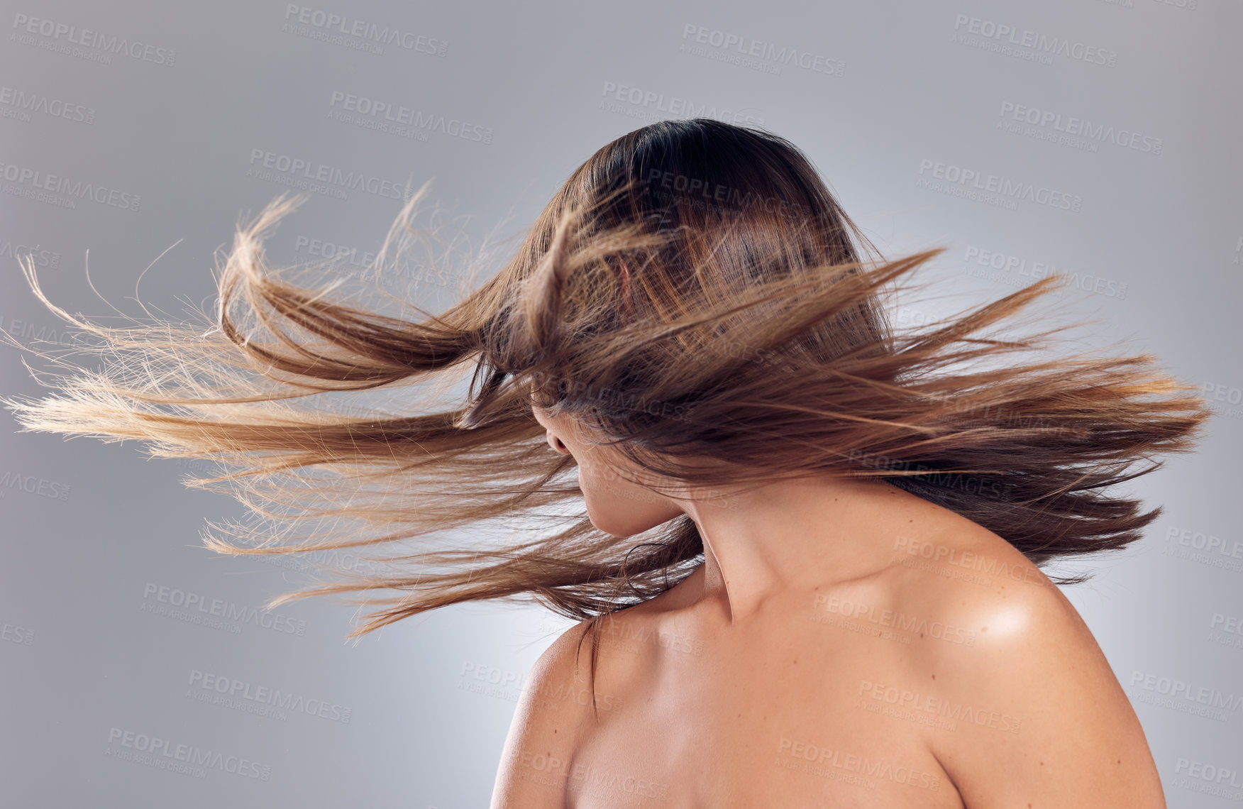 Buy stock photo Hair care, movement and woman in studio with growth, keratin treatment and balayage on gray background. Salon, excited and female person with cosmetic shine for style, texture and wellness or beauty