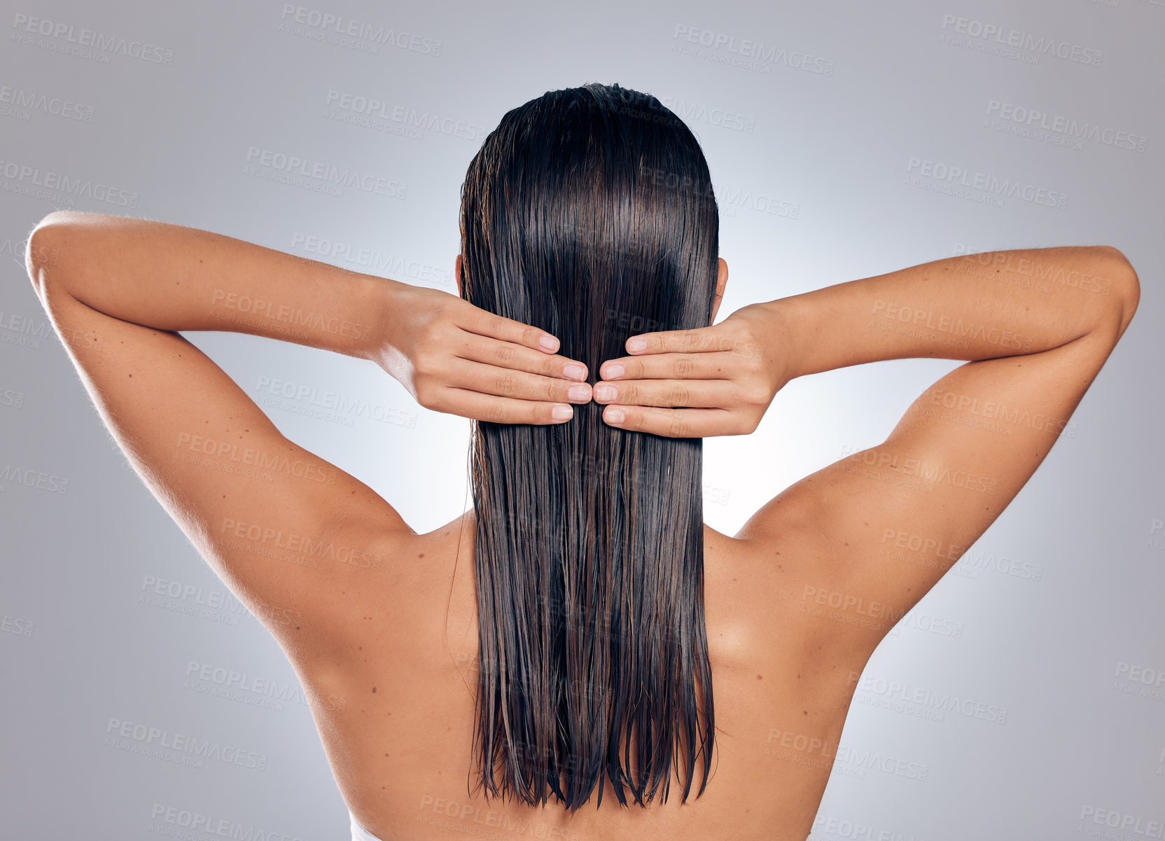 Buy stock photo Back, woman and hands with wet hair in studio for shampoo, hygiene and keratin treatment. Fresh, model girl and cleaning with cosmetics for shower, grooming and morning routine by white background