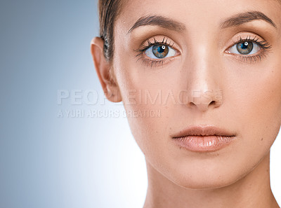 Buy stock photo Woman, portrait and skincare in studio, wellness and cosmetics to pamper on blue background. Female person, mockup space and transformation or facial treatment for glow, dermatology and smooth skin