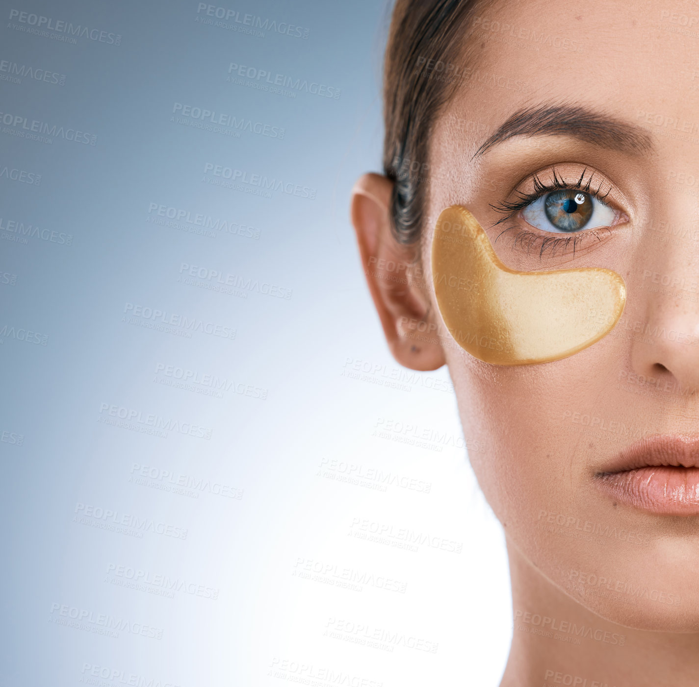 Buy stock photo Woman, closeup and eye patch for beauty and skincare, hydration and refresh on blue background. Mock up, dermatology and facial treatment for collagen, portrait and detox for female person in studio