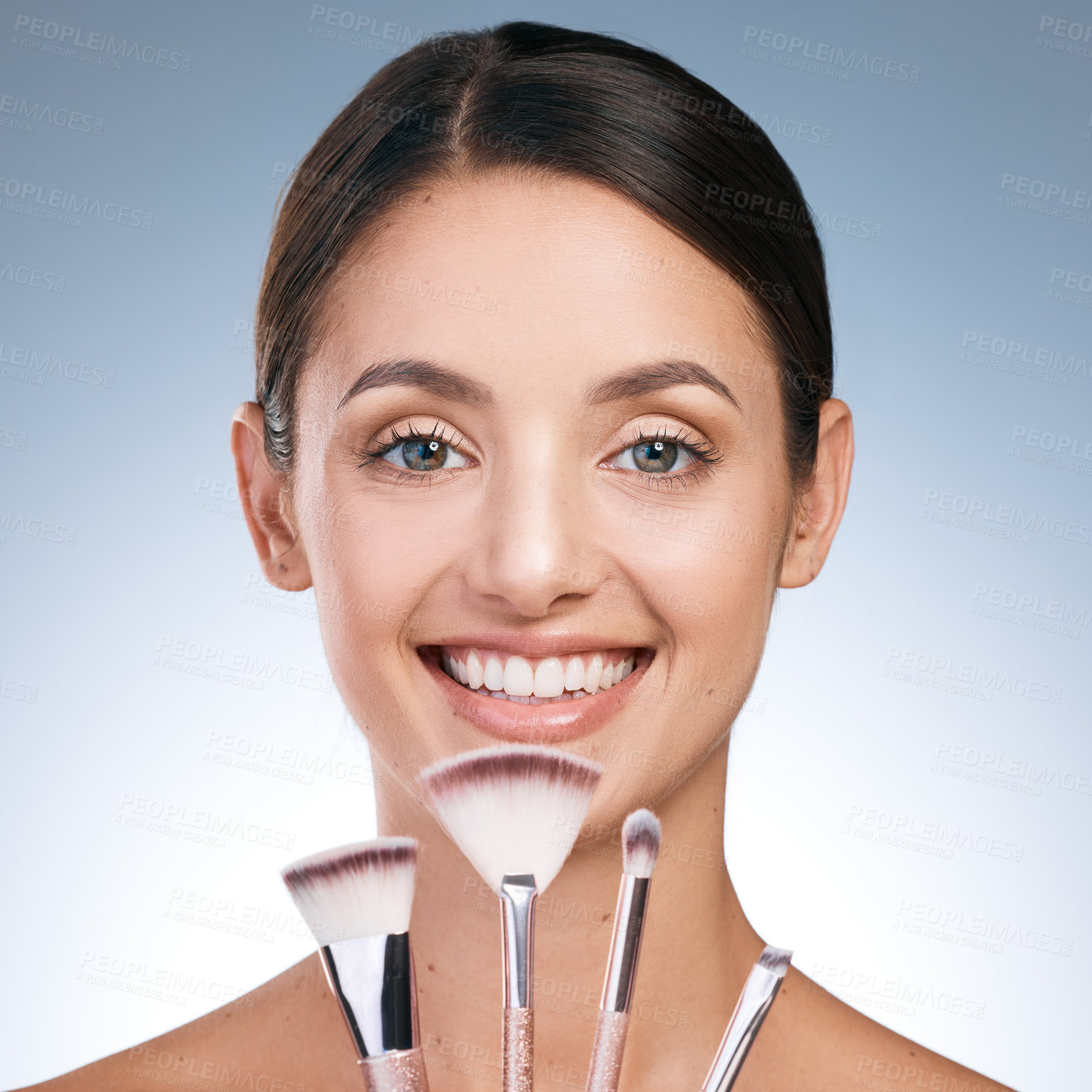 Buy stock photo Cosmetic, woman and portrait with brushes for makeup, beauty and application on blue background. Tools, foundation and equipment for skincare products, female person face and studio for grooming