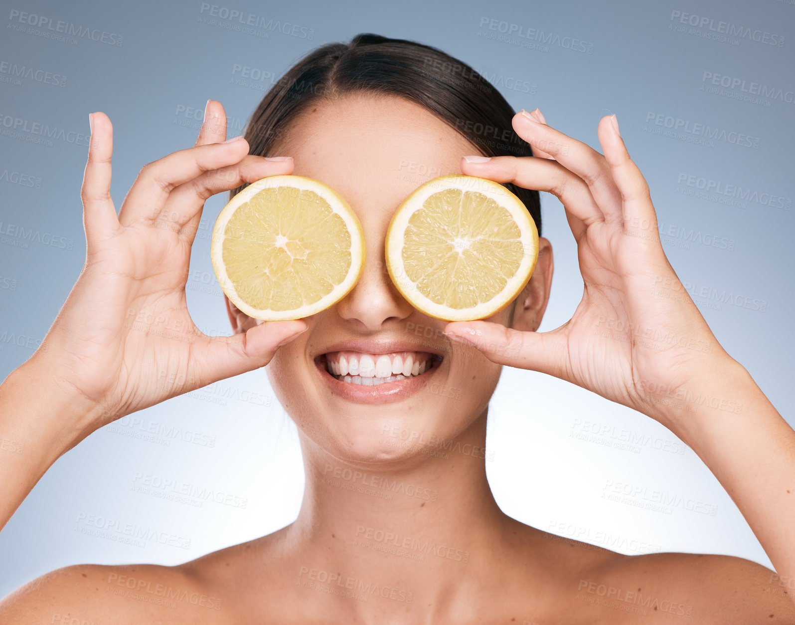 Buy stock photo Happy woman, skincare and beauty with orange slices with fruit, vitamin c or natural in blue background. Female person, face and organic for cosmetic, pride or glow for dermatology in studio backdrop