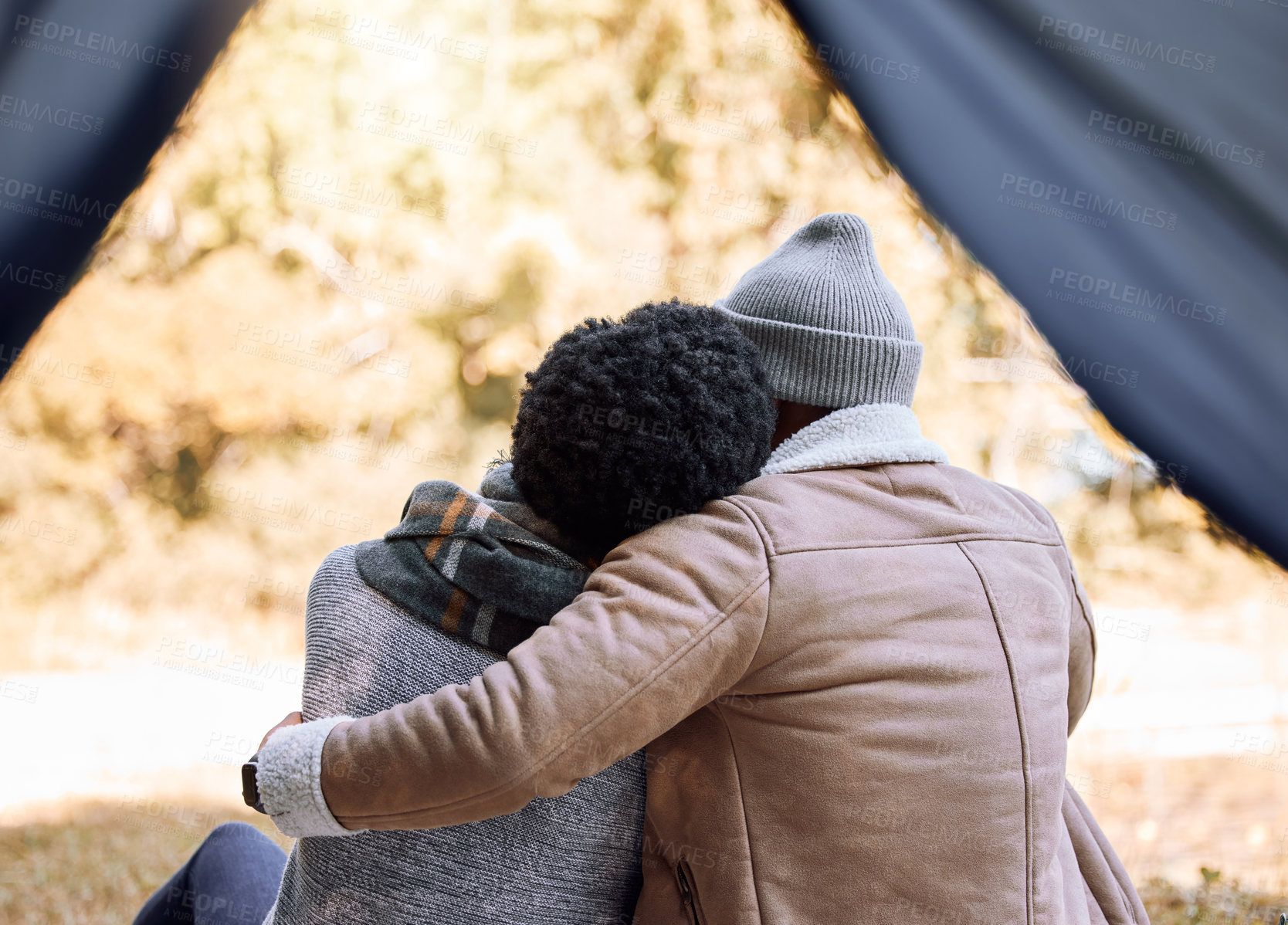 Buy stock photo Shot of a young couple enjoying the scenery while camping