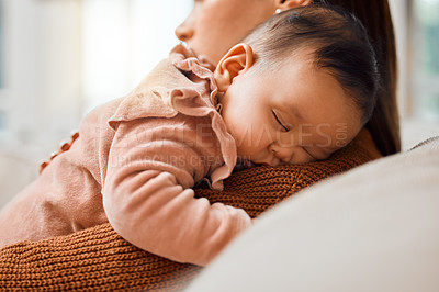 Buy stock photo Shot of an adorable baby girl sleeping on her mother's arms
