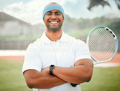 Buy stock photo Cropped portrait of a handsome young male tennis player standing outside with his arms folded