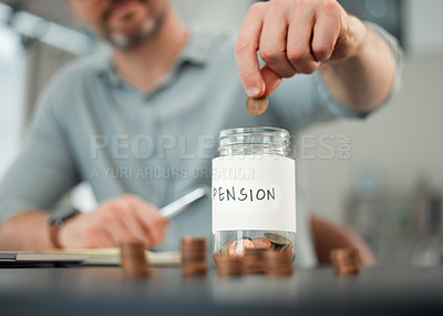 Buy stock photo Cropped shot of an unrecognizable man putting coins into a jar marked 