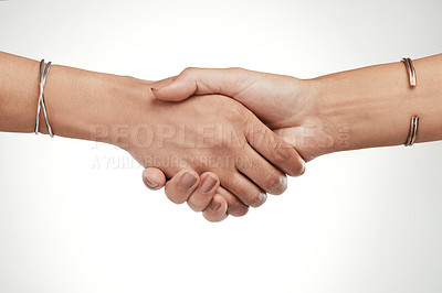 Buy stock photo Cropped shot of two unrecognizable women shaking hands in the studio