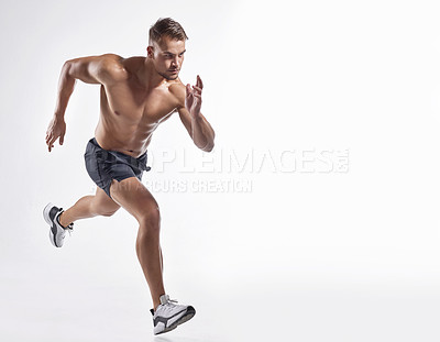 Buy stock photo Shot of an athletic young man against a white background