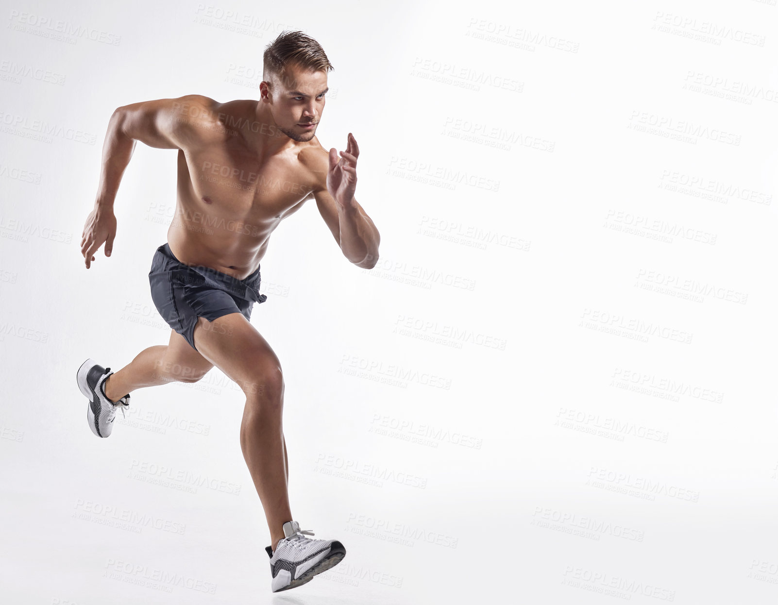 Buy stock photo Shot of an athletic young man against a white background