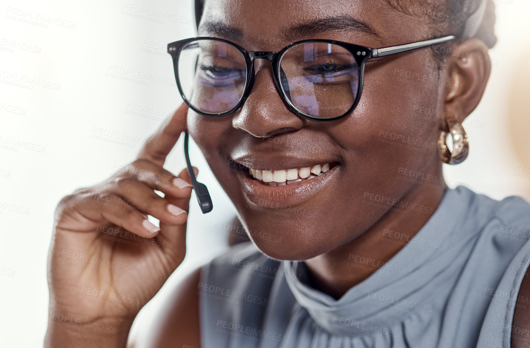 Buy stock photo Shot of a young woman using a headset in a modern office