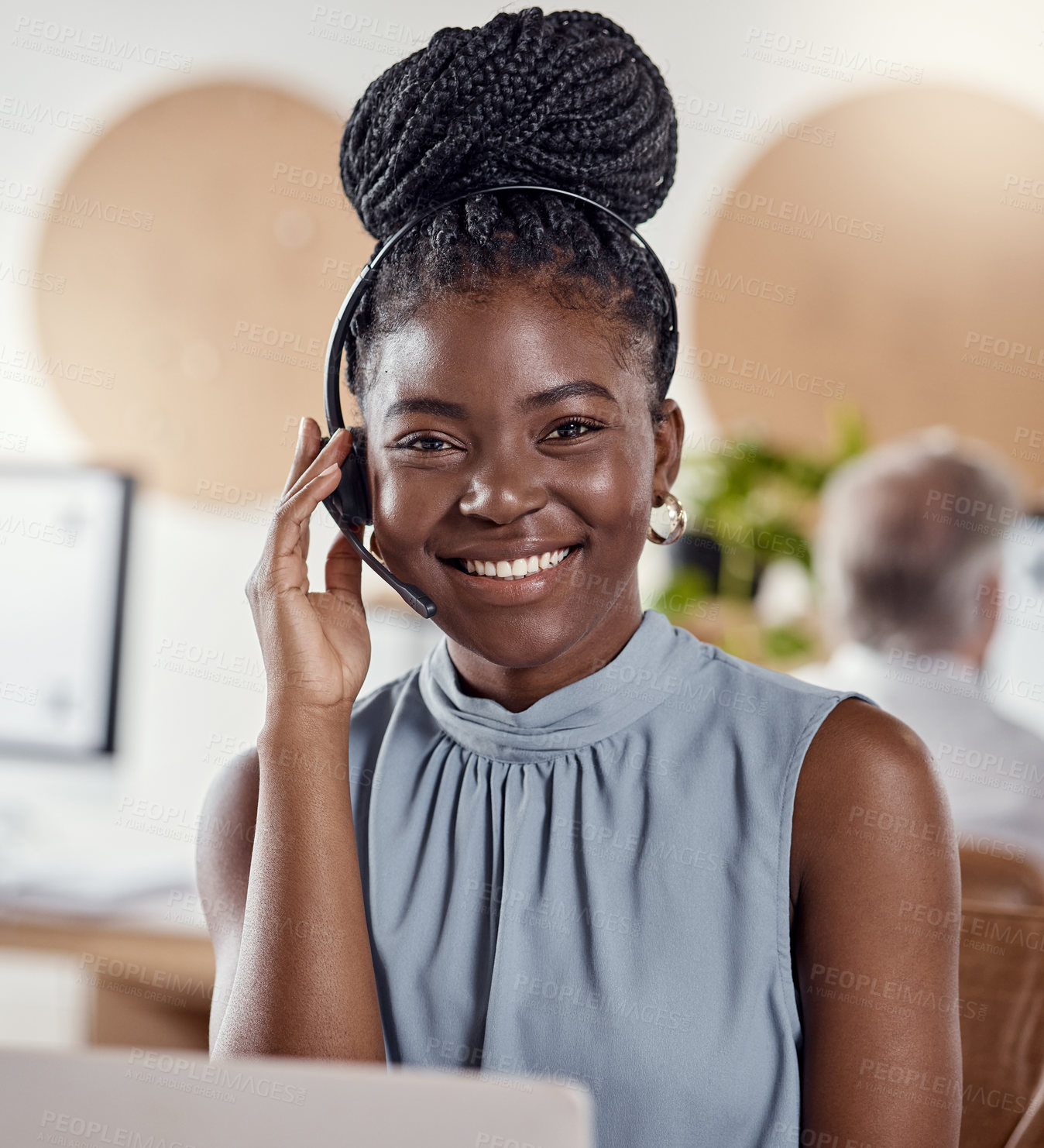 Buy stock photo Shot of a young woman using a headset and laptop in a modern office