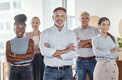 Buy stock photo Portrait of a group of confident businesspeople working together in a modern office
