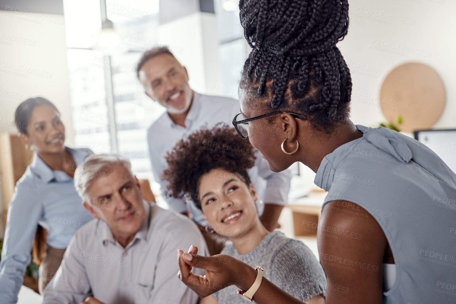 Buy stock photo Shot of a group of businesspeople having a meeting in a modern office