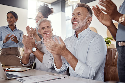 Buy stock photo Shot of a group of businesspeople clapping during a conference in a modern office