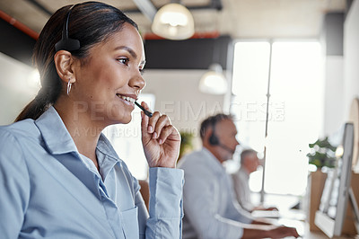 Buy stock photo Shot of a young woman using a headset in a modern office