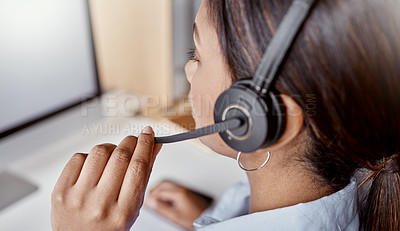 Buy stock photo Shot of a woman using a headset and laptop in a modern office