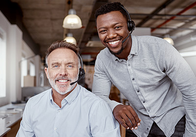 Buy stock photo Portrait of two men using headsets in a modern office