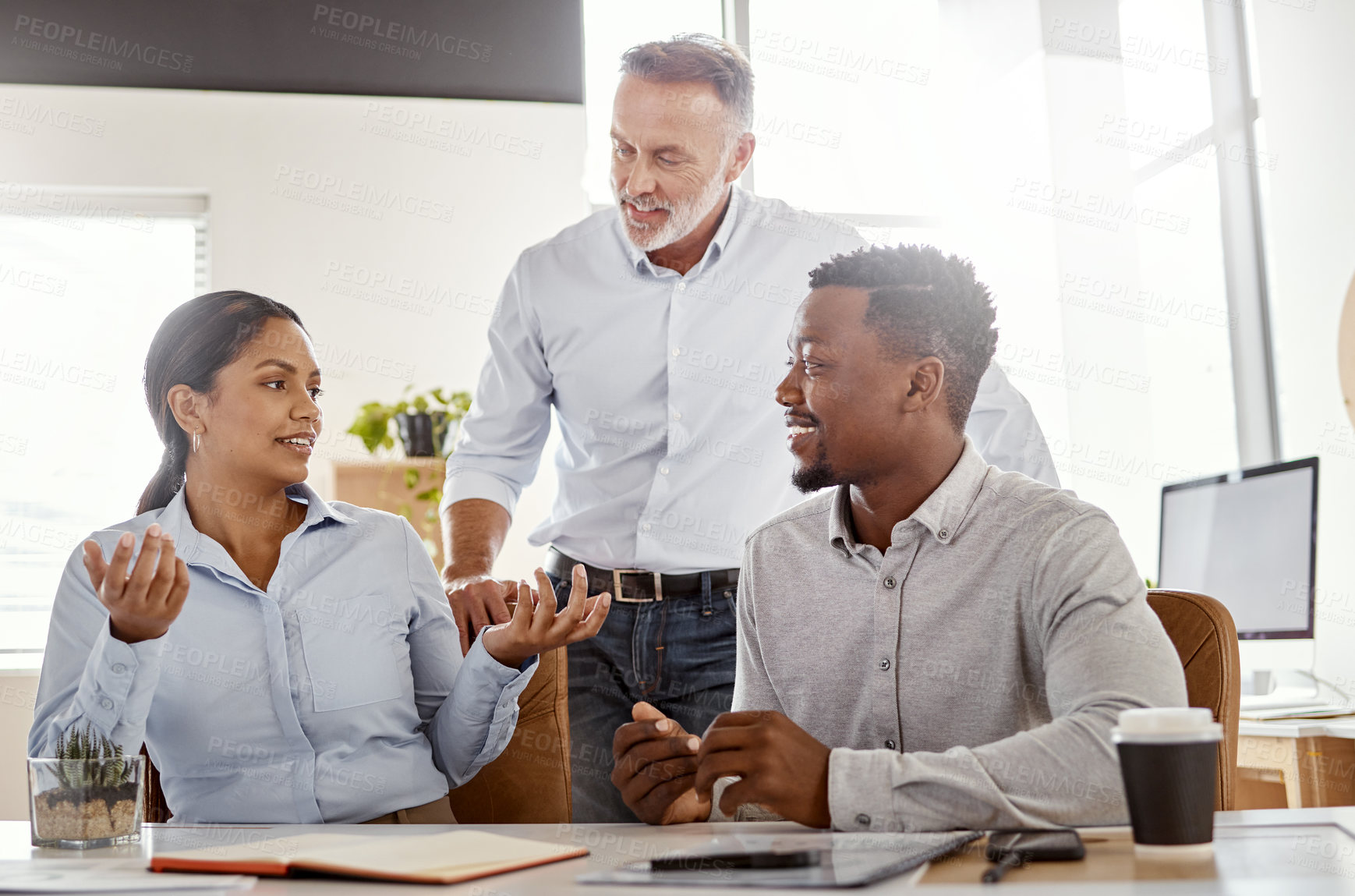 Buy stock photo Shot of a group of businesspeople having a meeting in a modern office