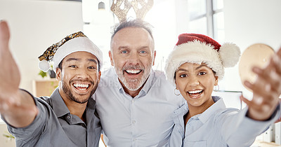 Buy stock photo Shot of a group of businesspeople taking selfies during Christmas in a modern office