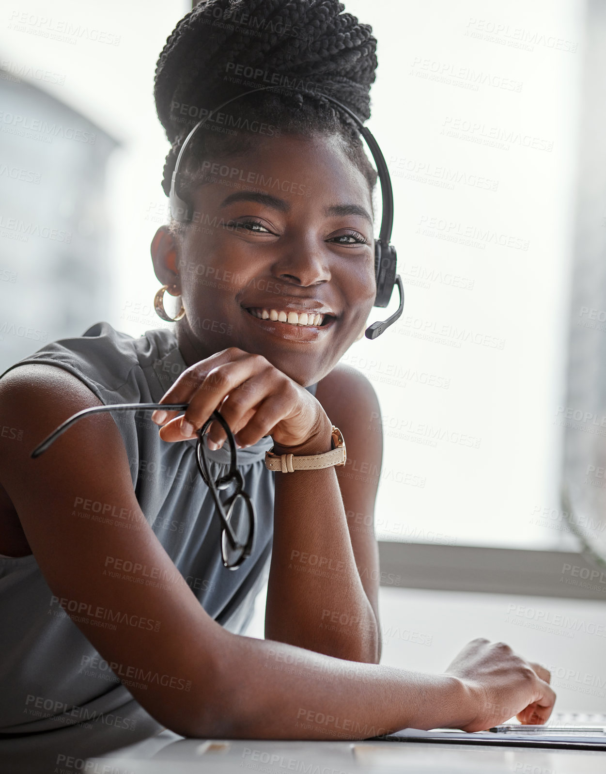 Buy stock photo Shot of a young woman using a headset in a modern office