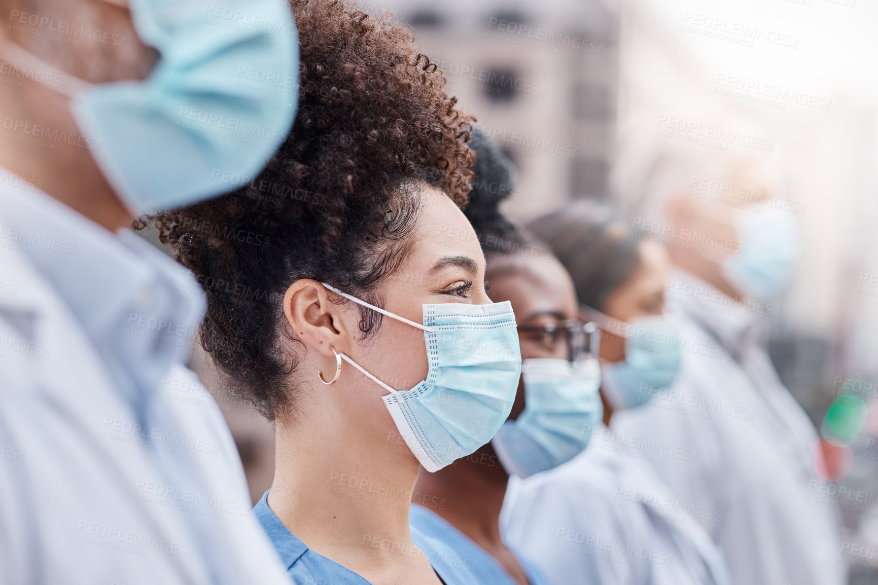 Buy stock photo Closeup shot of a group of doctors wearing masks