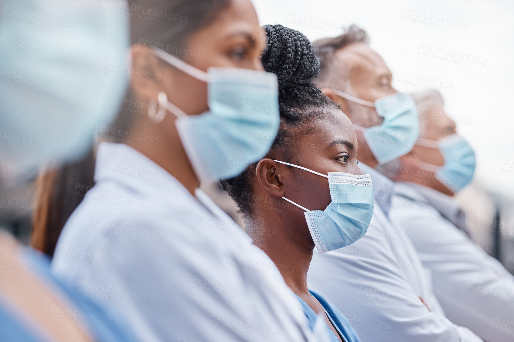 Buy stock photo Closeup shot of a group of doctors wearing masks