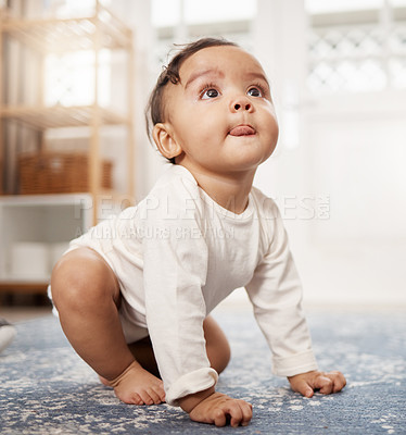 Buy stock photo Shot of an adorable baby girl sitting on the floor at home