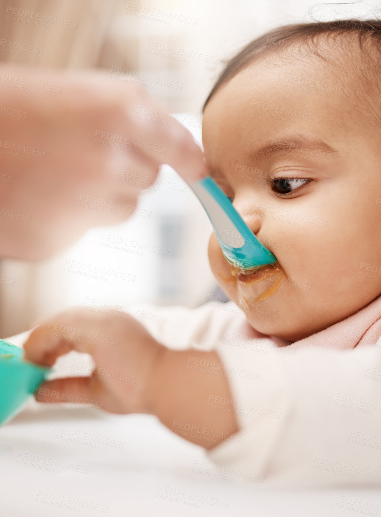 Buy stock photo Shot of an adorable baby girl eating her food