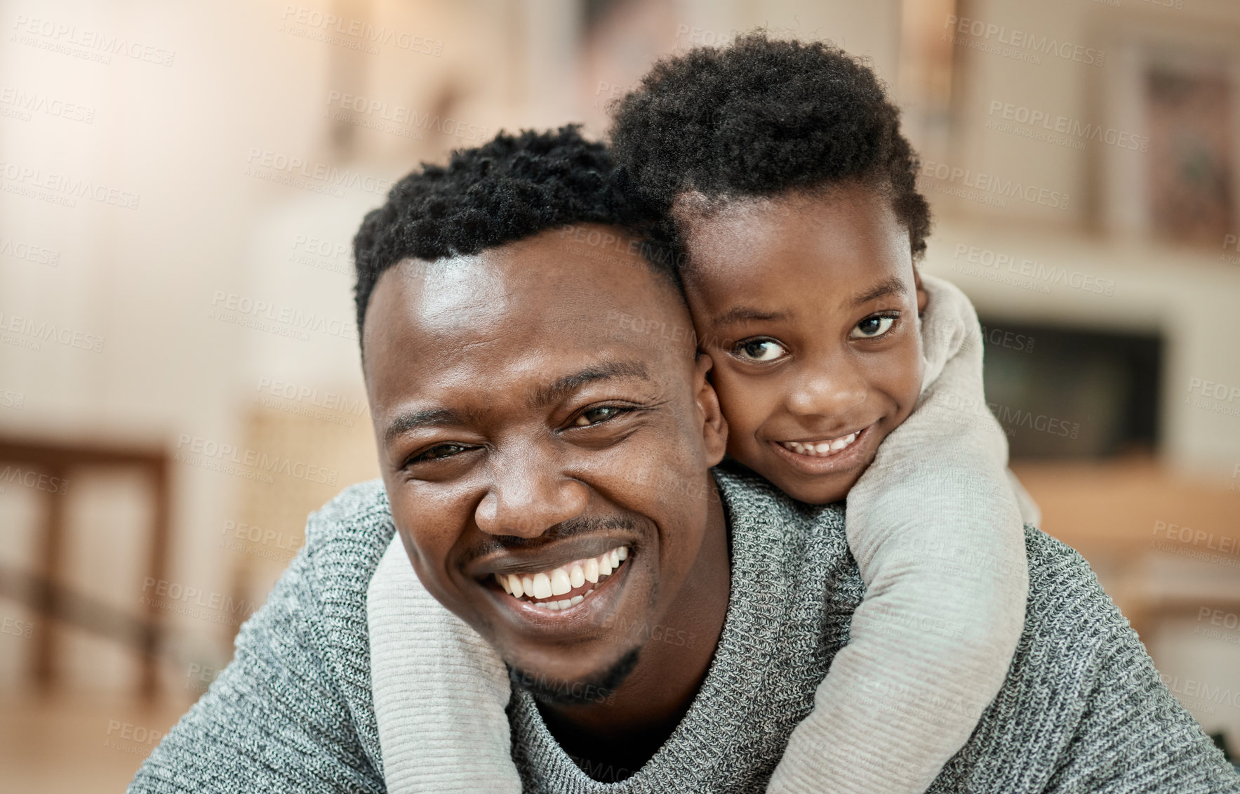 Buy stock photo Portrait, dad and hug with child in home, love and black man with son or happy for family connection. Father, smile and embrace with kid on break, support and bonding with single parent in house