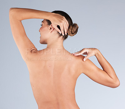 Buy stock photo Shot of an unrecognizable woman standing alone in the studio and posing