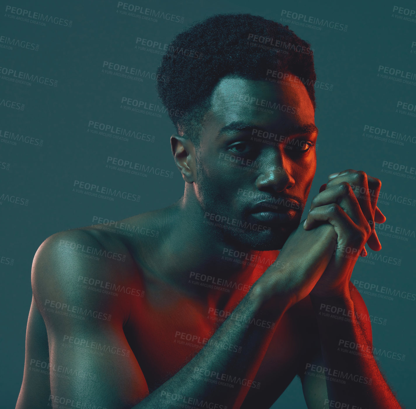 Buy stock photo Shot of a handsome young man posing in the studio